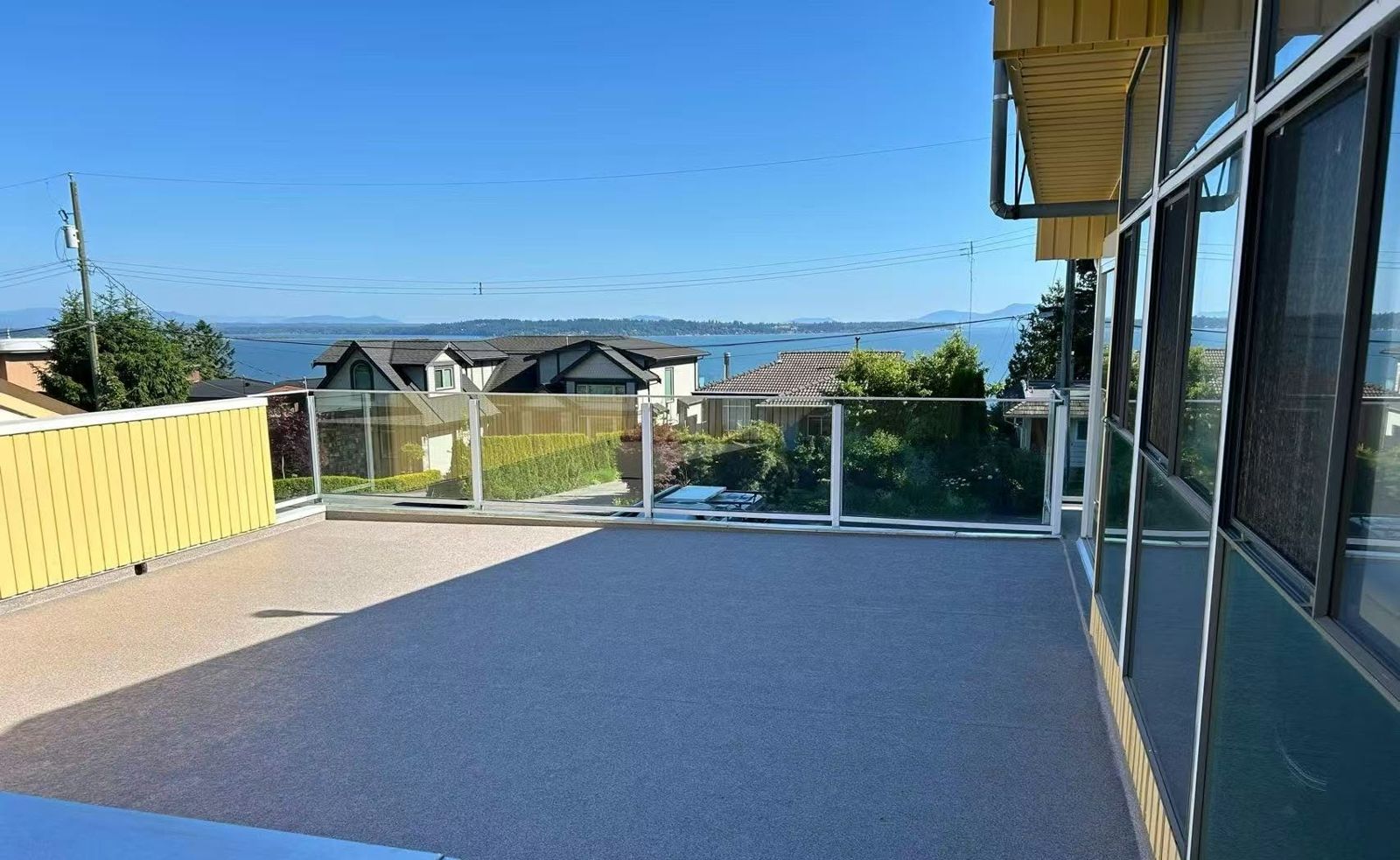 Ocean-view deck with glass railing